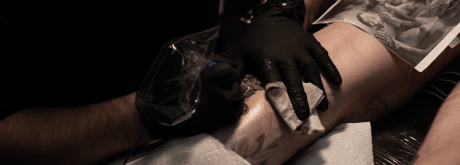 Caesar tattooing a very detailed large black and gray leg sleeve